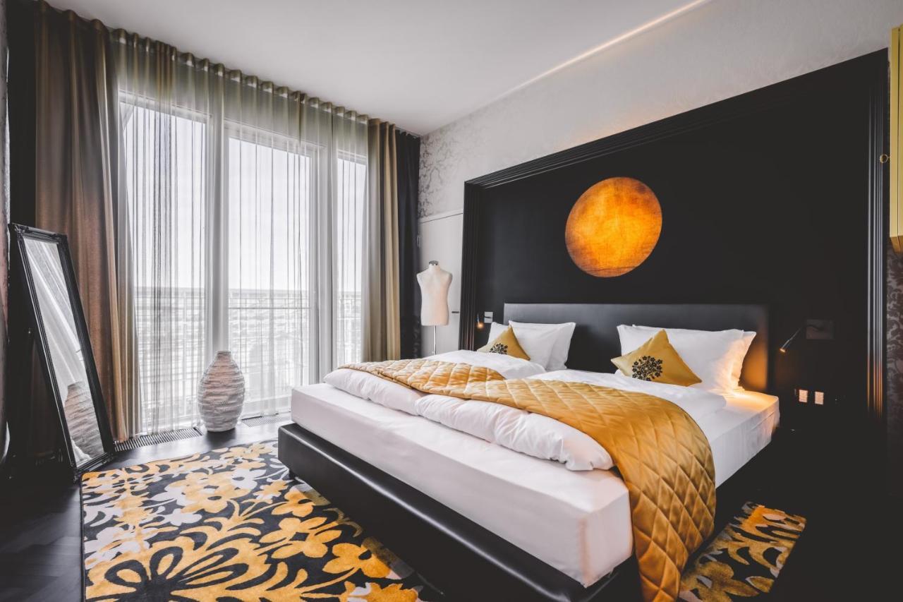 Kameha Grand Bonn Bona Quarto foto A bedroom at the hotel
